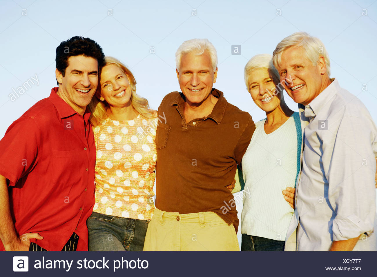Portrait Of Three Mature Men And Two Mature Women Standing Together And Smiling Stock Photo Alamy