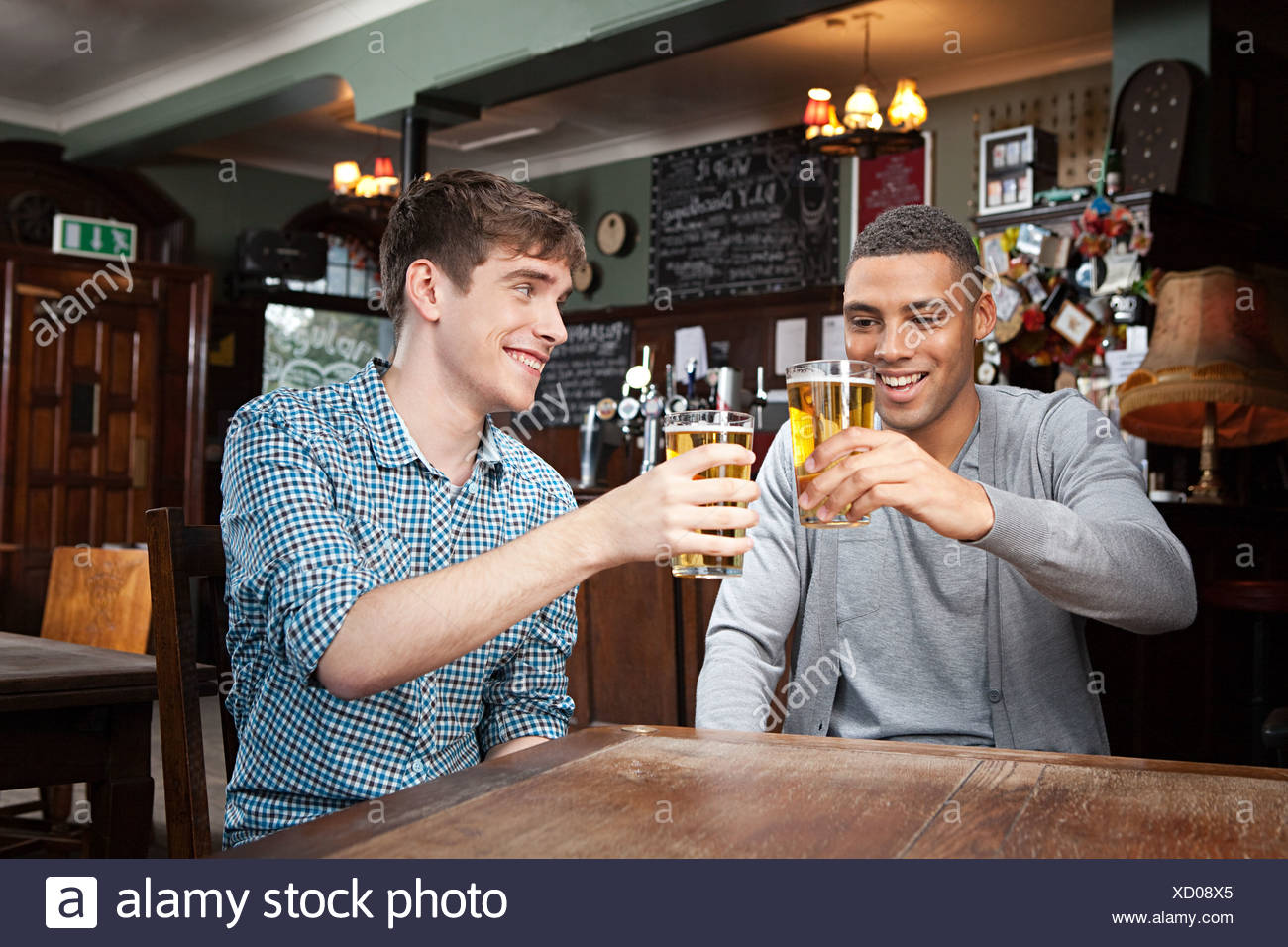 Young men in bar Stock Photo