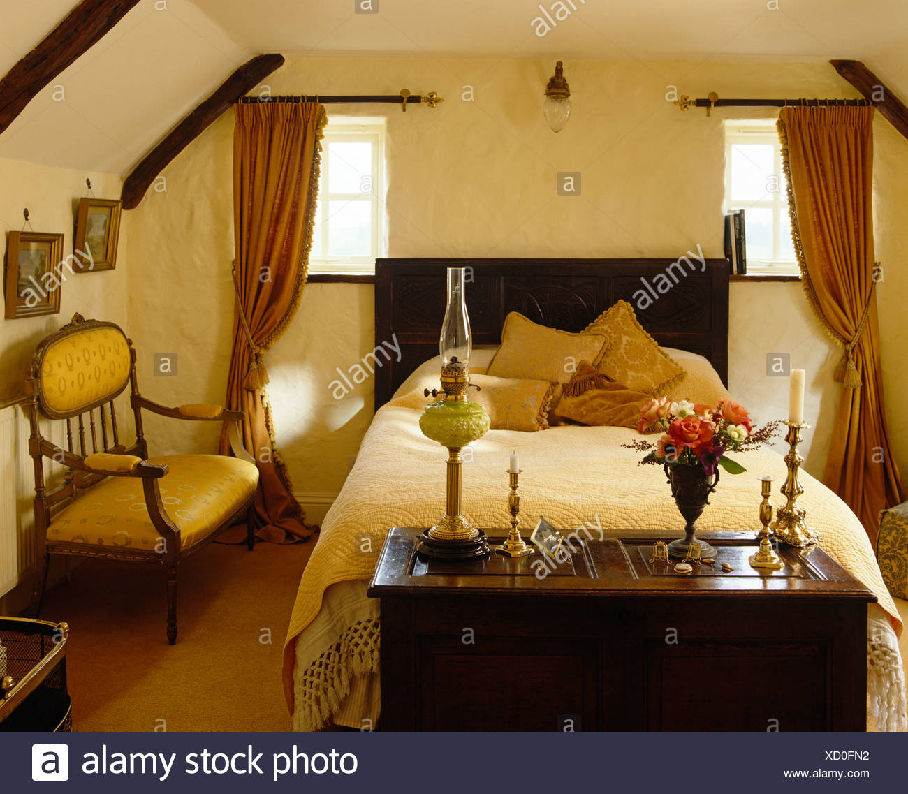 Old Wooden Chest At Foot Of Double Bed With Cream Bed Cover In