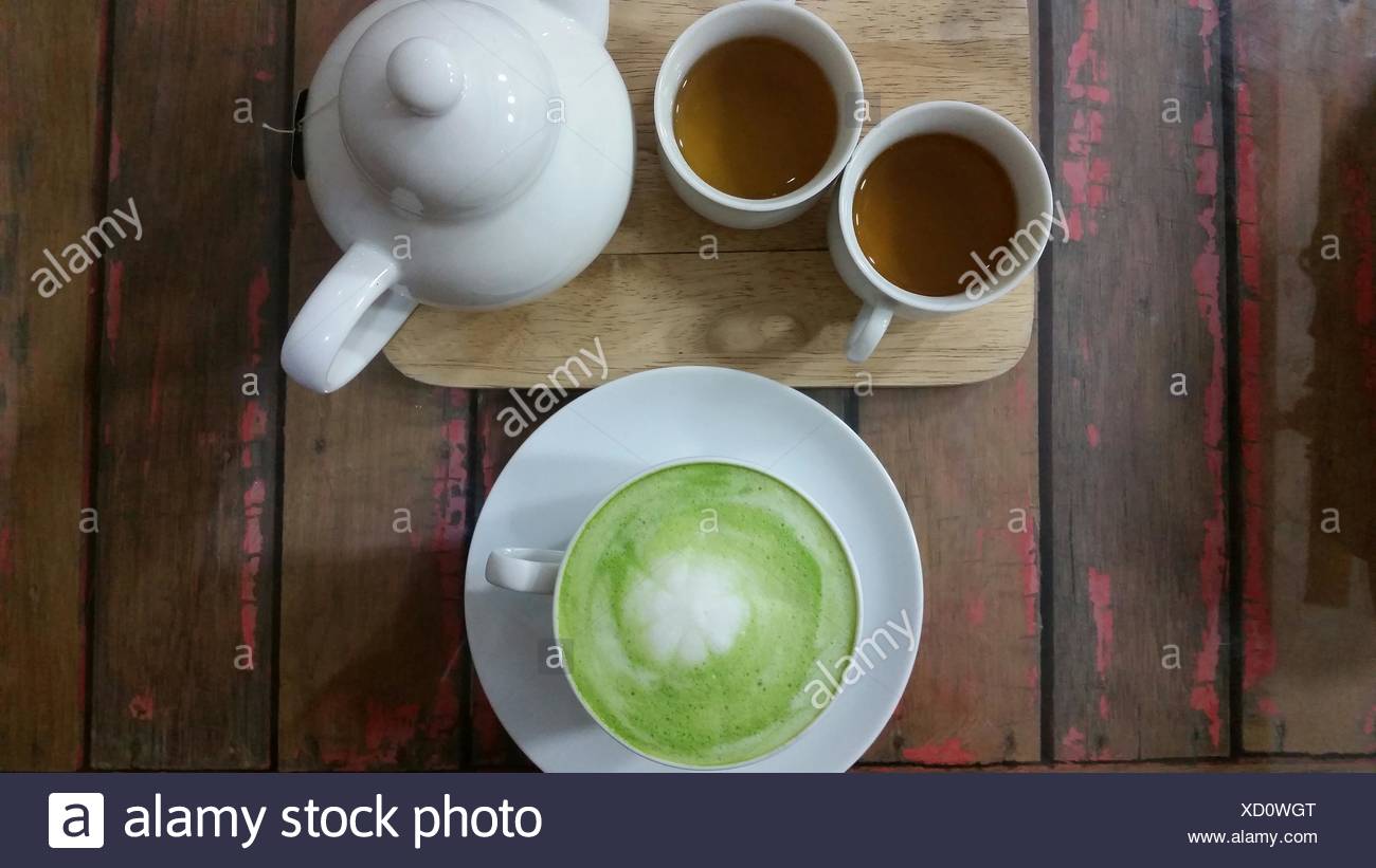 Matcha Latte And Two Cups Of Tea Stock Photo