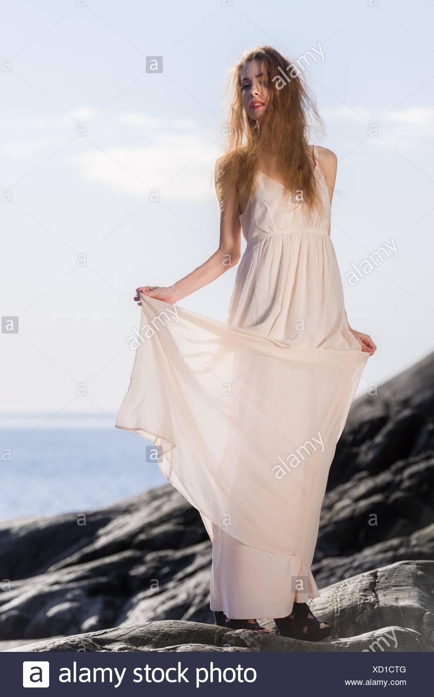 white dress by the shore
