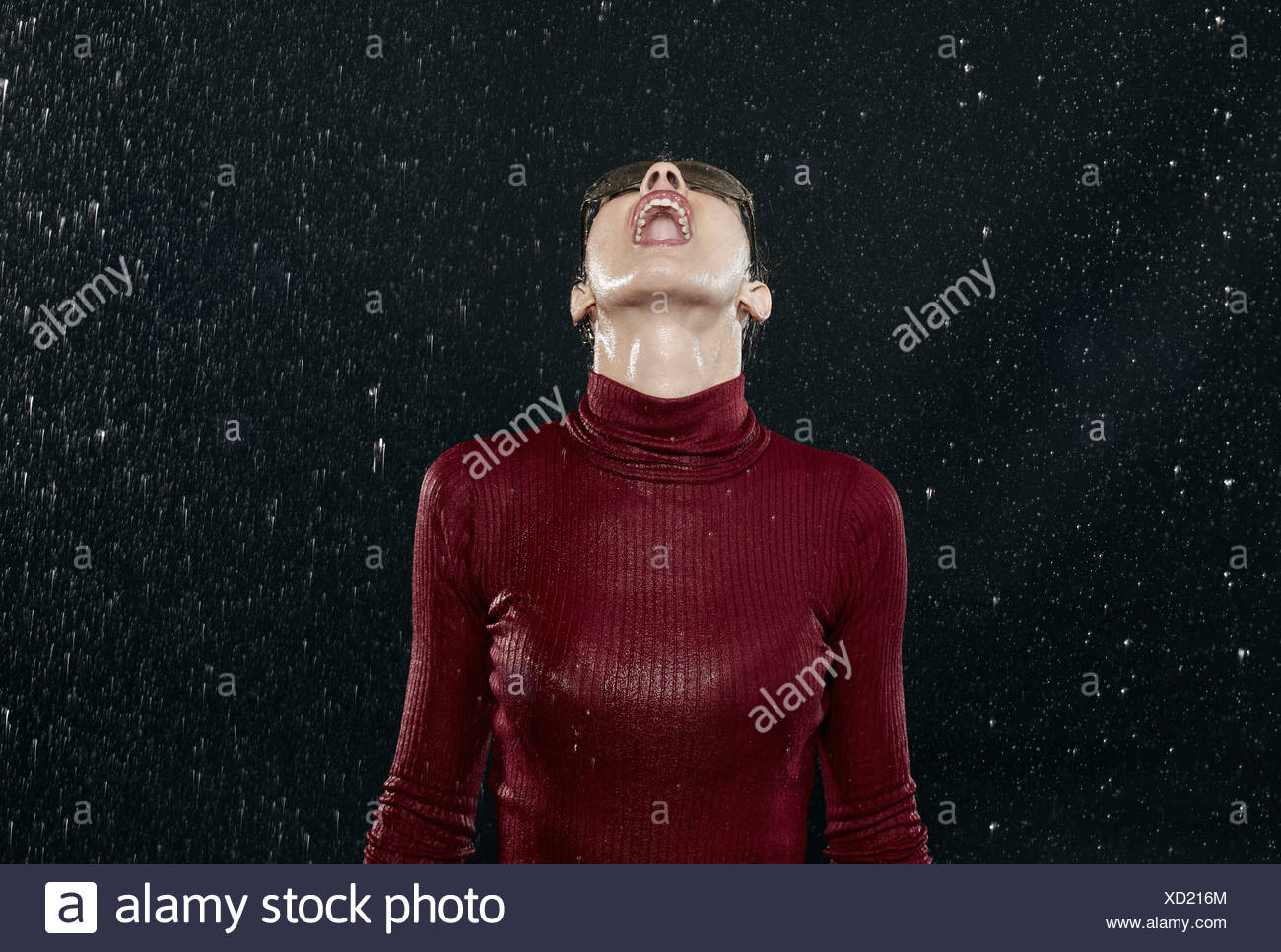 Woman Getting Wet In Rain Stock Photos & Woman Getting Wet In Rain