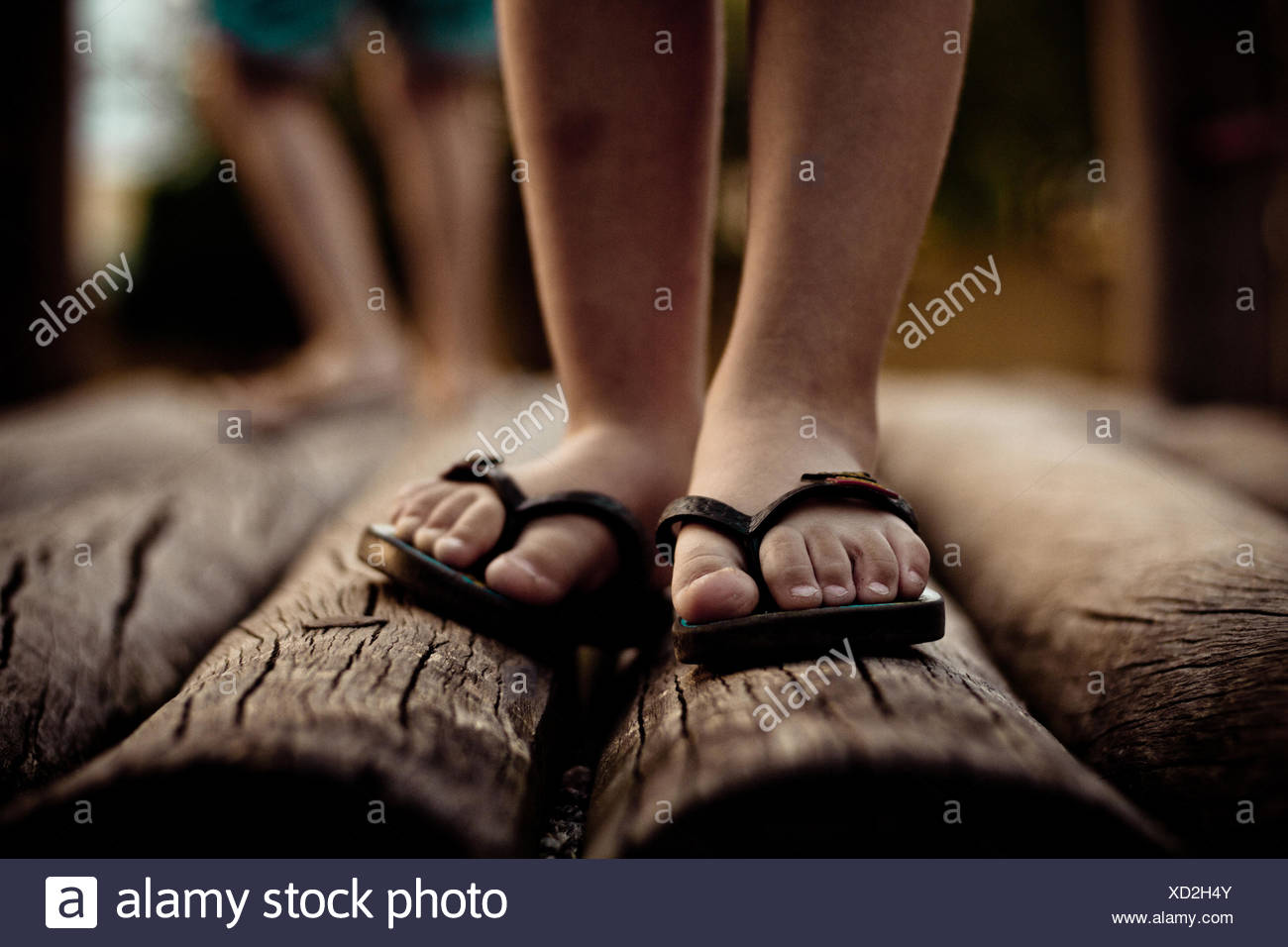 Close up of feet in flip flops Stock Photo