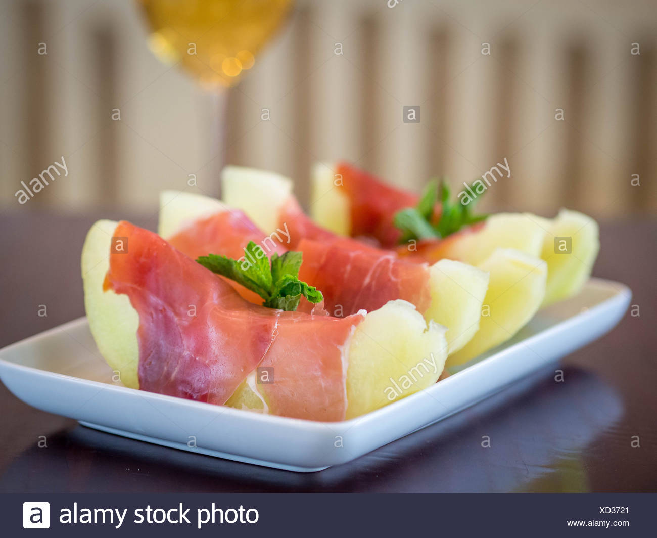 Melon wrapped in parma ham Stock Photo: 283427817 - Alamy