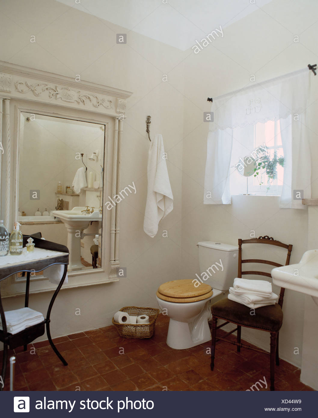 White Voile Drapes And Large White Painted Carved Mirror In French