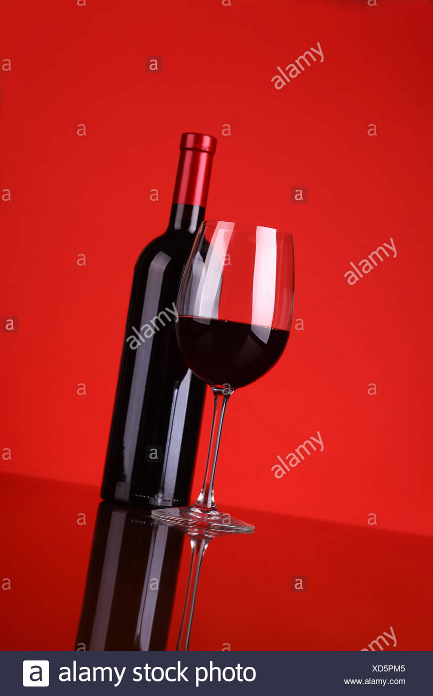 Download Glass And Bottle Of Red Wine Over A Red Background Stock Photo Alamy PSD Mockup Templates