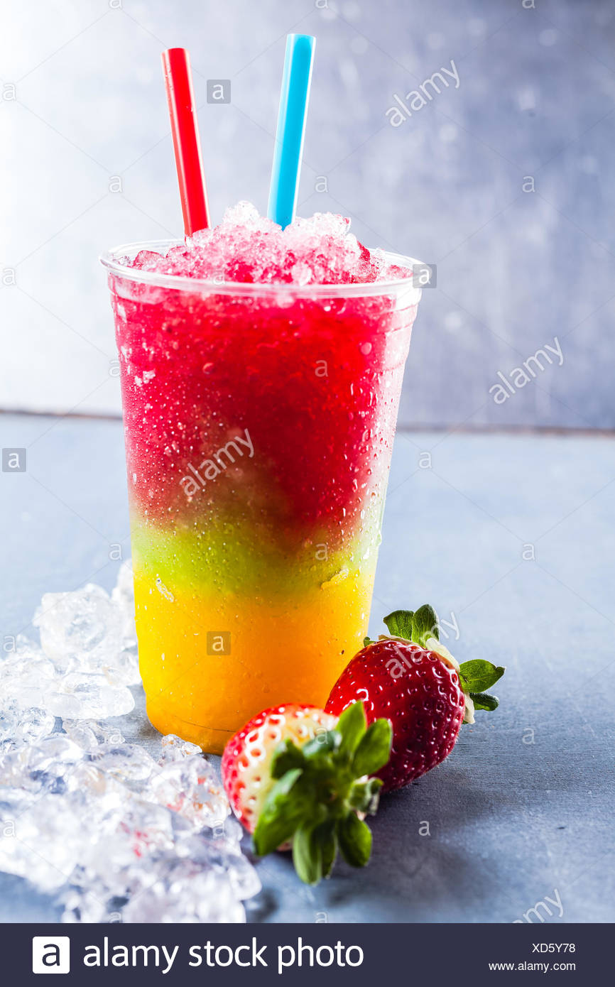 Download Close Up Of Colorful Rainbow Layered Frozen Fruit Slush Granita Drink On Metal Counter In Plastic