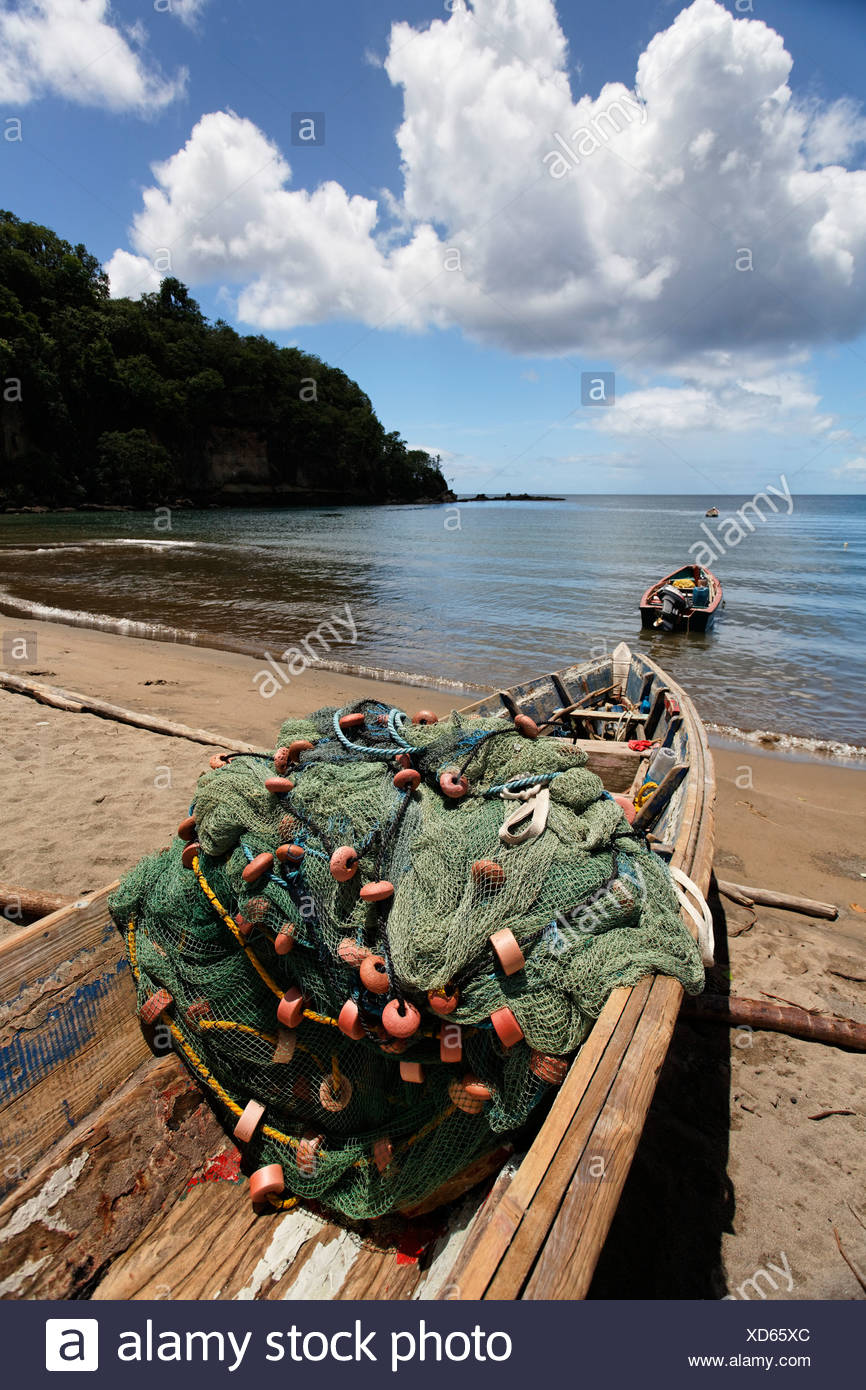 Fishing Boat On A Beach With A Net Sea Horizon Clouds Saint Lucia Lca Windward Islands Lesser Antilles Caribbean Stock Photo Alamy