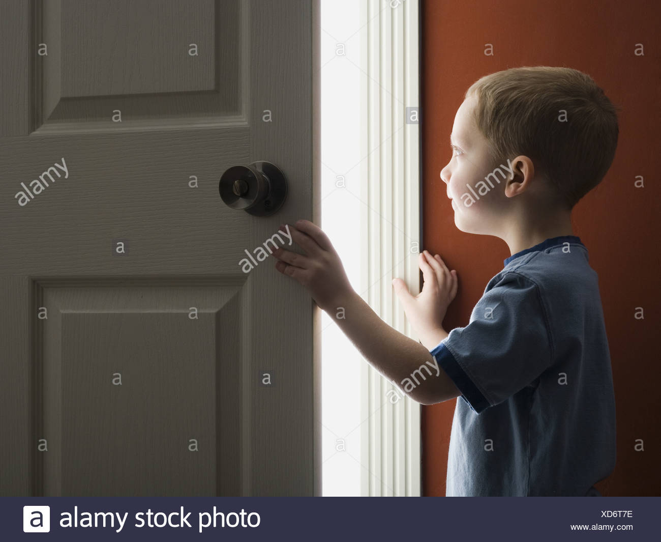 Young Boy Looking Through Doorway Stock Photo 283507154 Alamy