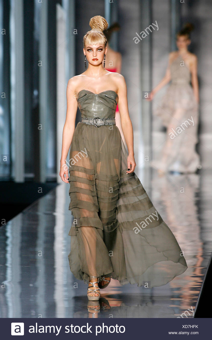 Christian Dior Paris Haute Couture Autumn Winter Model wearing a flolength  flowing pink and green chiffon sheer pleated dress Stock Photo - Alamy