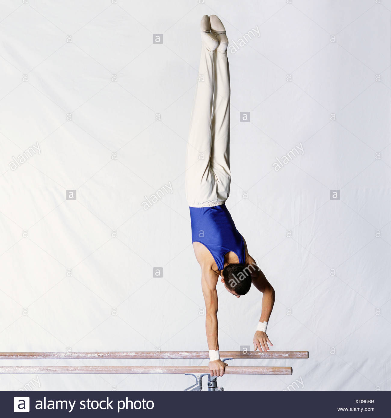 Gymnast On Parallel Bars Stock Photos & Gymnast On Parallel Bars Stock