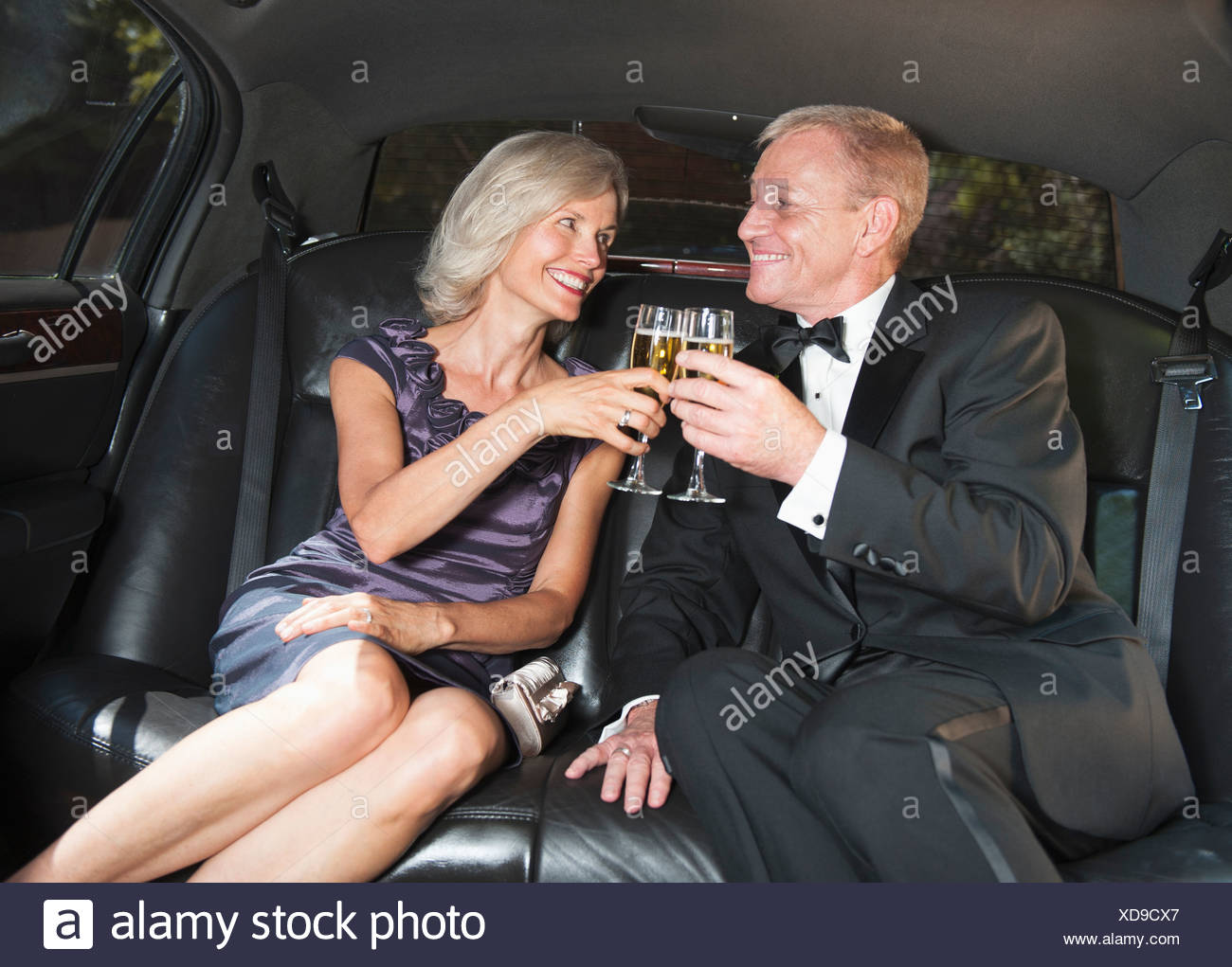 Usa New York State Old Westbury Parents Of Bride Drinking Champagne Inside Limousine Stock Photo Alamy