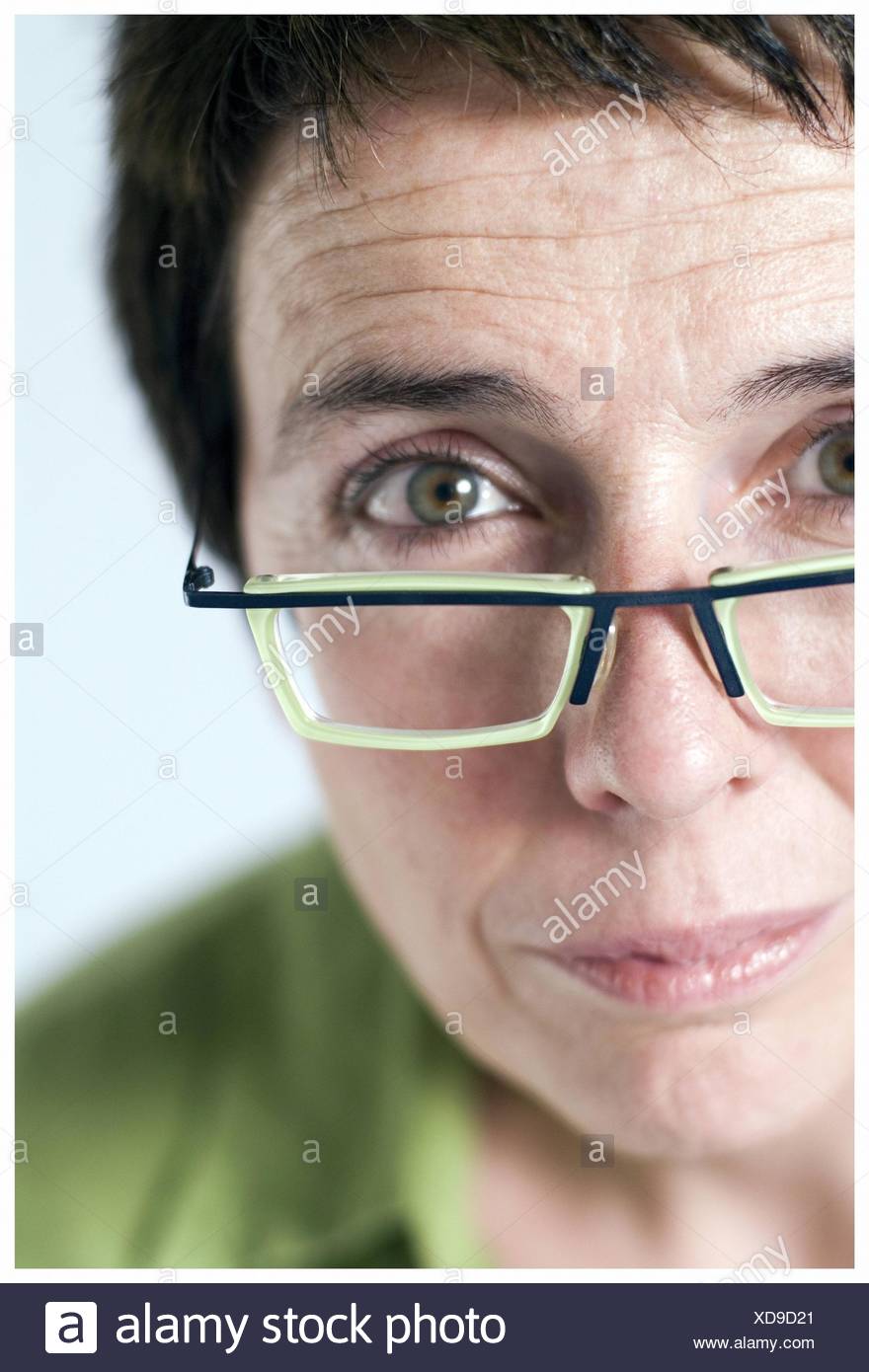 Portrait Of Woman With Green Eyes With Glasses Dark And Short