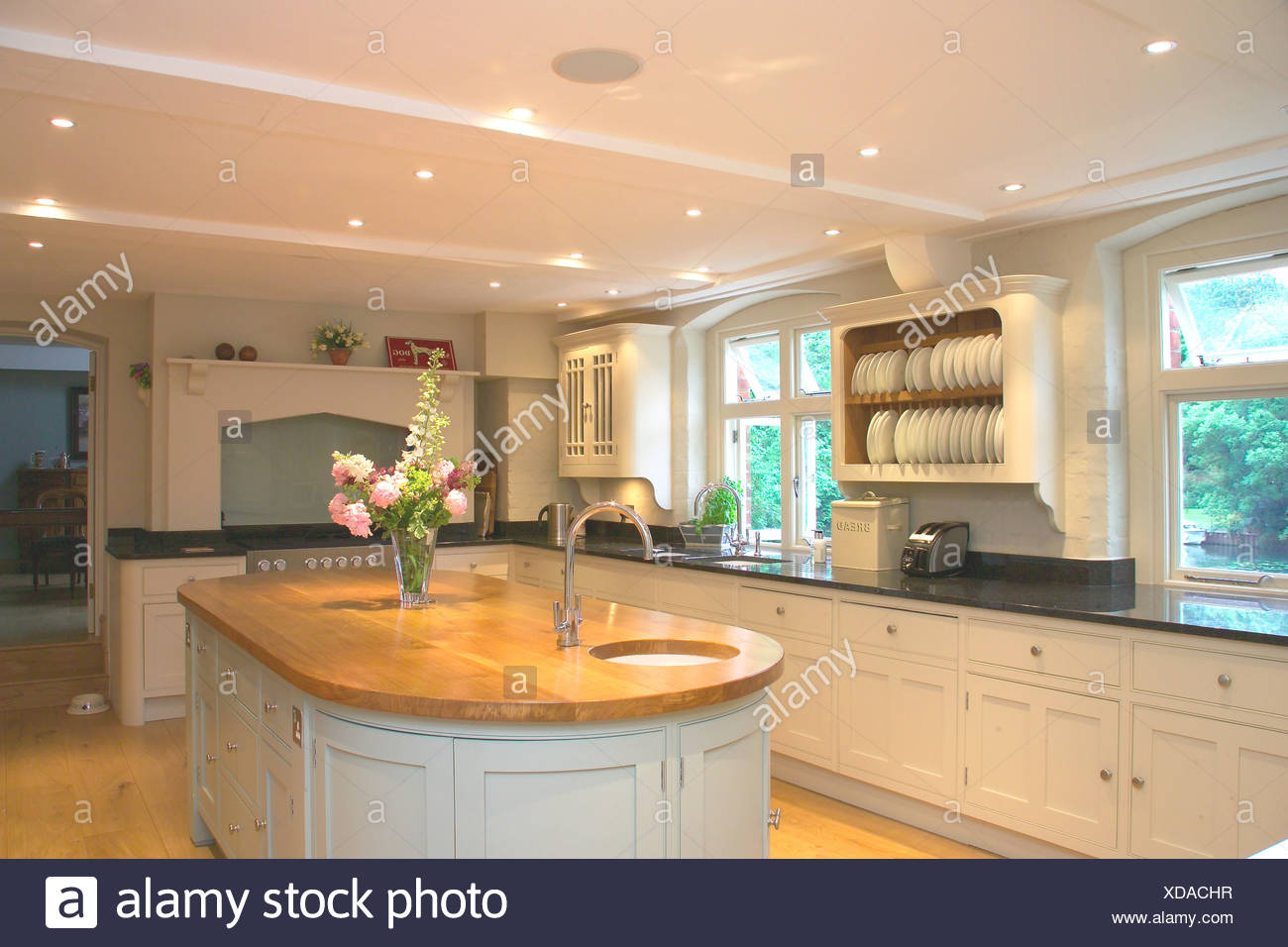 Recessed Ceiling Lighting In Modern White Kitchen With Sink In