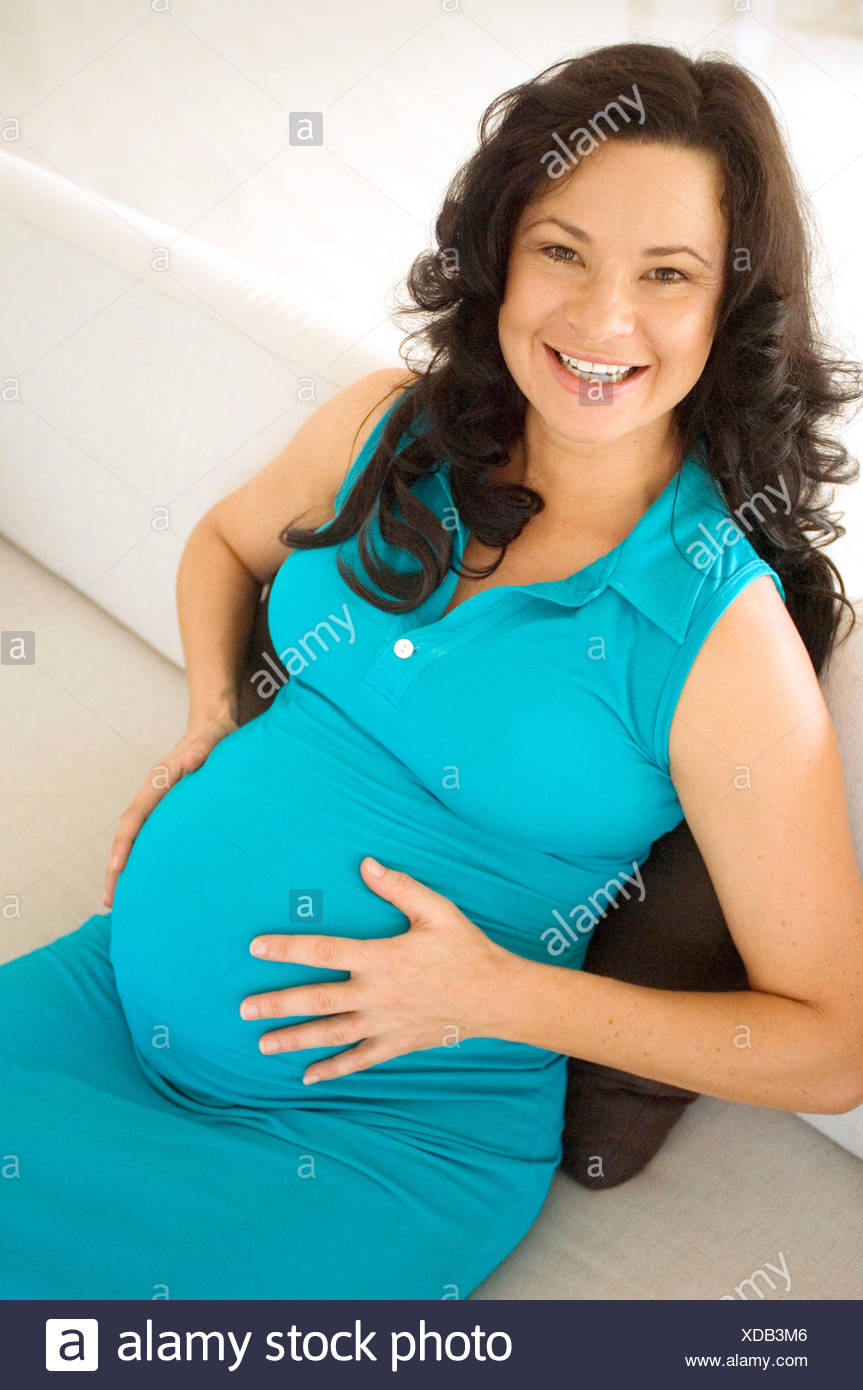 Pregnant Female With Long Curly Brunette Hair Turquoise Blue