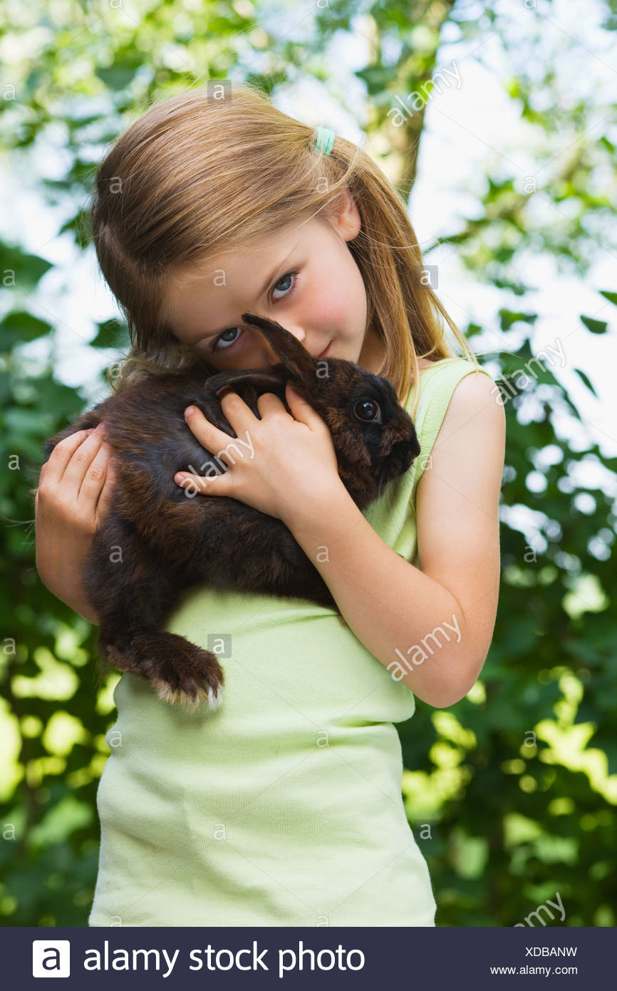 Girl Holding A Rabbit Stock Photos & Girl Holding A Rabbit Stock Images ...