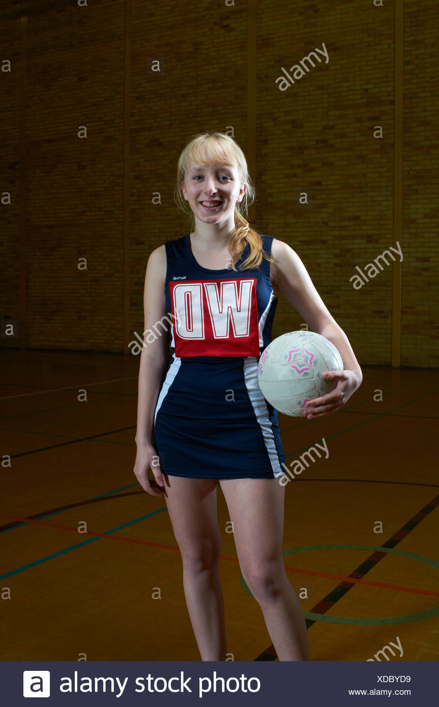 Portrait Of Netball Player Holding Ball Stock Photo