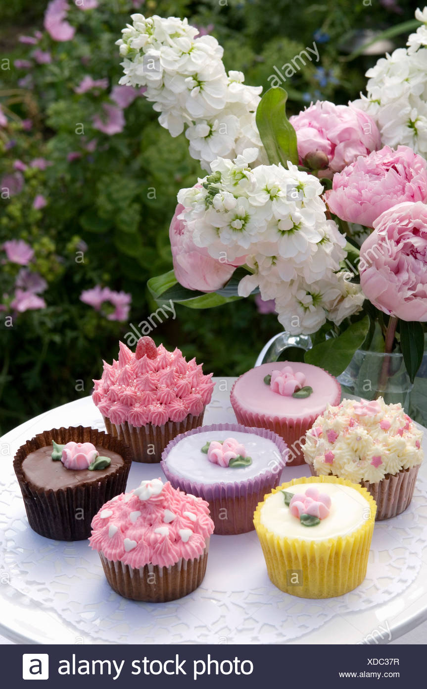 An English Cream Tea Cupcakes Decorated With Icing On A Cakestand
