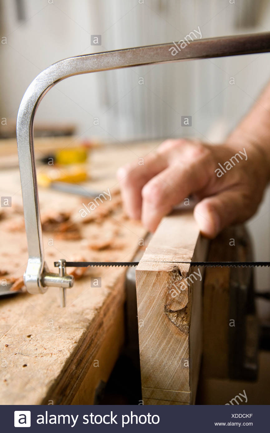 Carpenter Holding Hand Saw High Resolution Stock Photography and Images