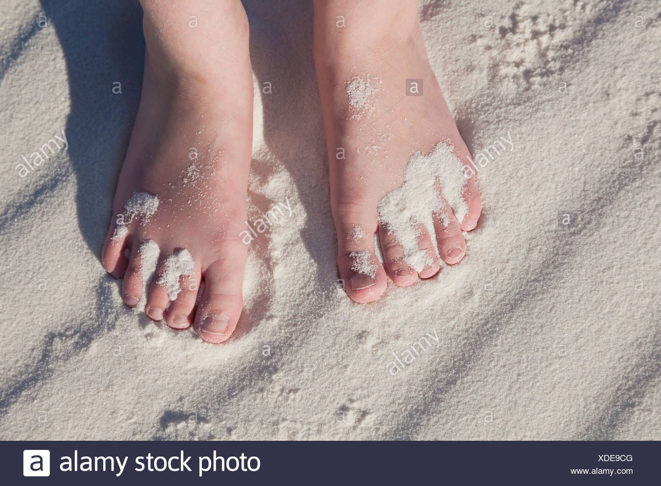 USA, New Mexico, Whitesands, Girl's feet on sand Stock Photo - Alamy