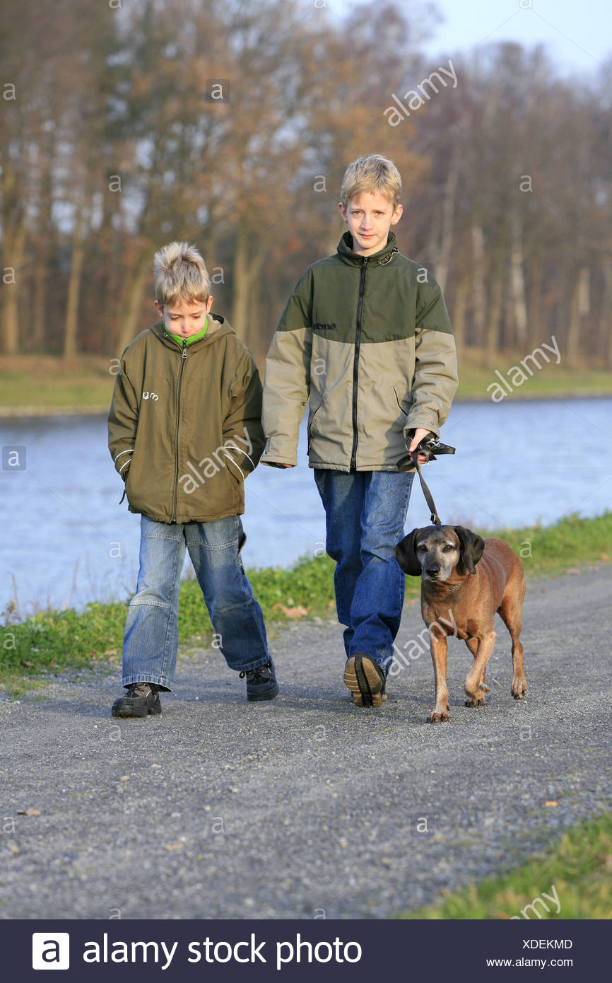 kids walking dog