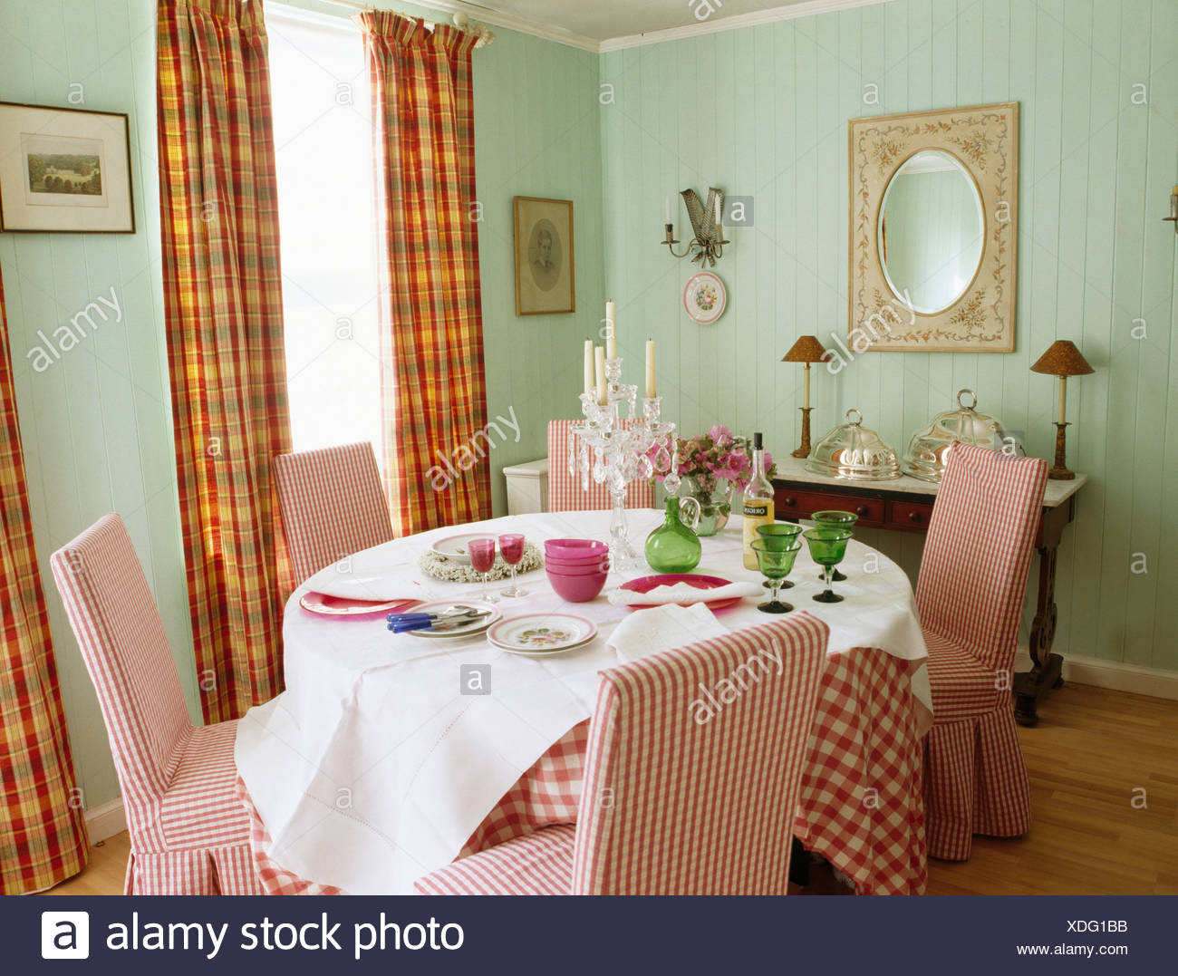 Red White Checked Upholstered Chairs In Pale Green Dining Room With White Linen And Red Checked Cloths On Table Stock Photo Alamy