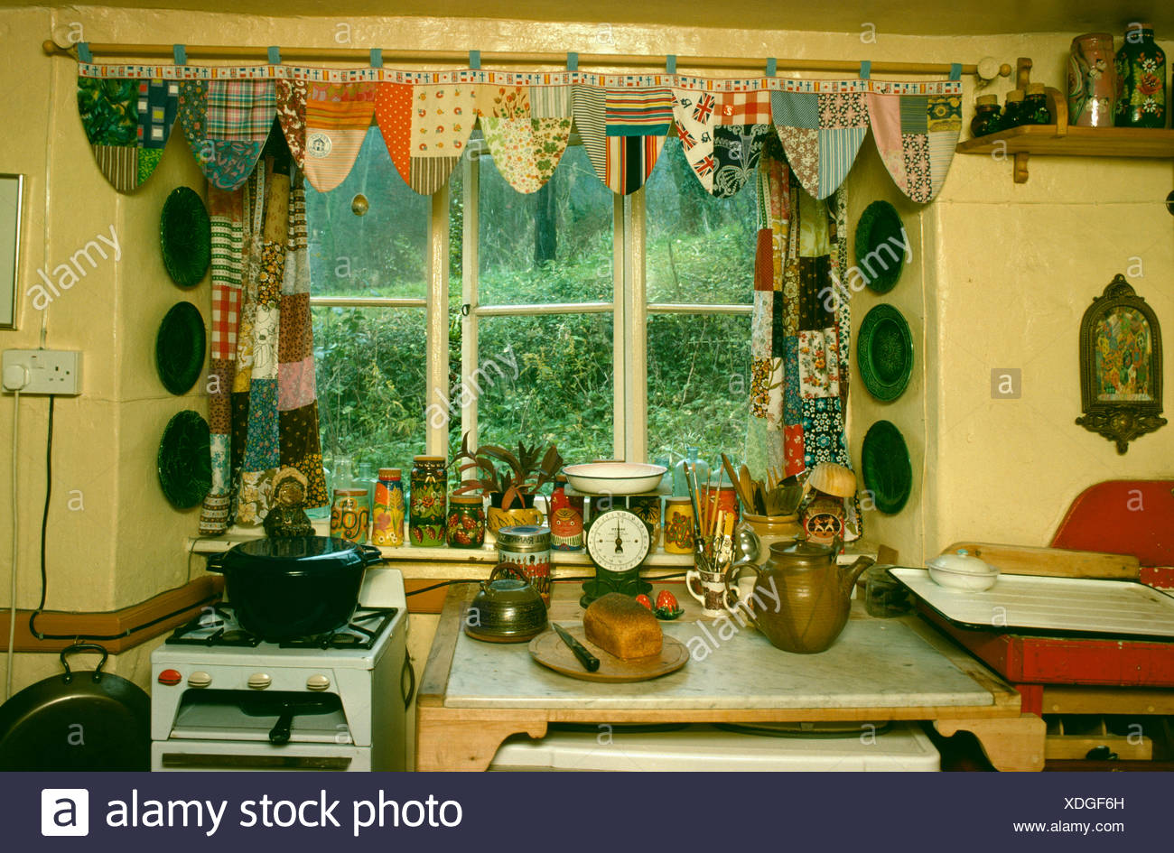 Close Up Of Seventies Kitchen Window With Patchwork Curtains And