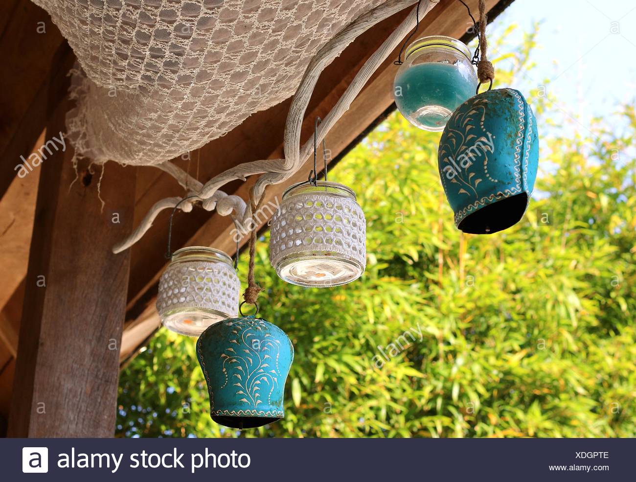 Low Angle View Of Decorative Lights Hanging On Porch Roof Stock