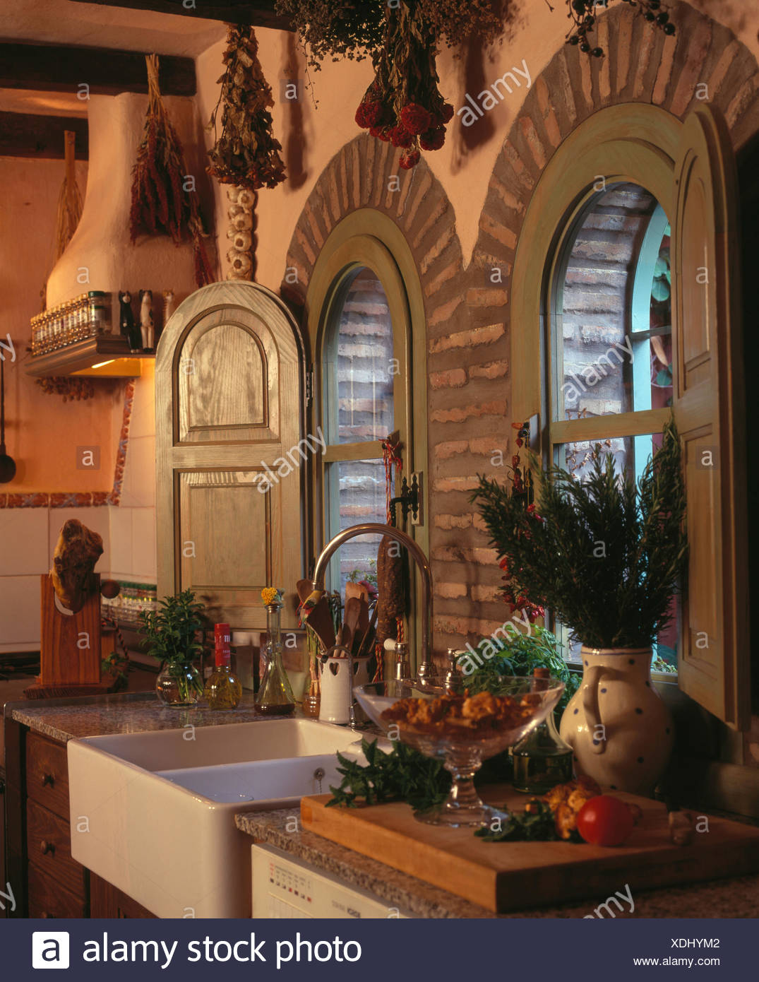 Wooden Shutters On Arched Windows Above Double Belfast Sink