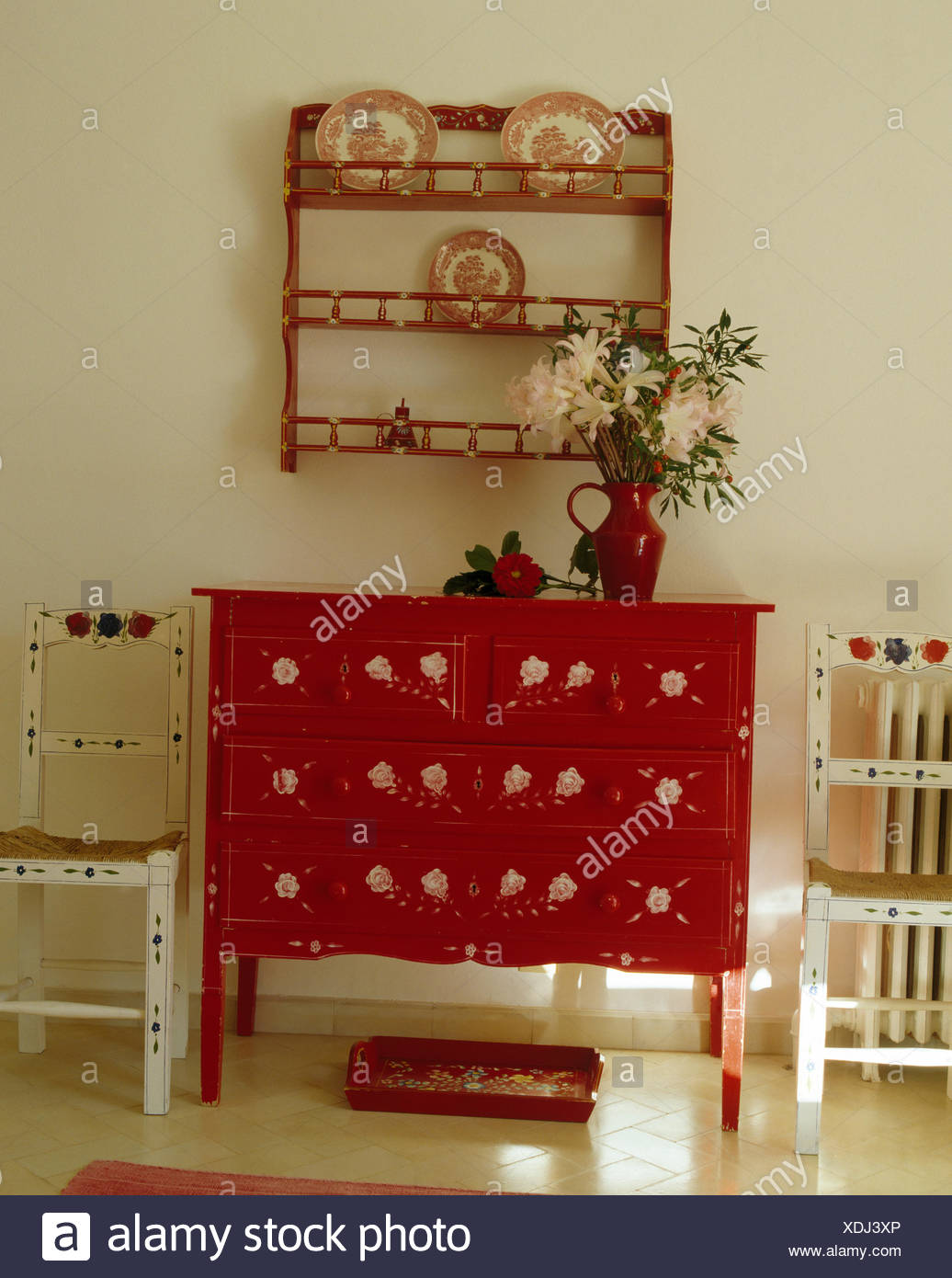 Red Painted Chest Of Drawers And White Painted Chairs Below Small