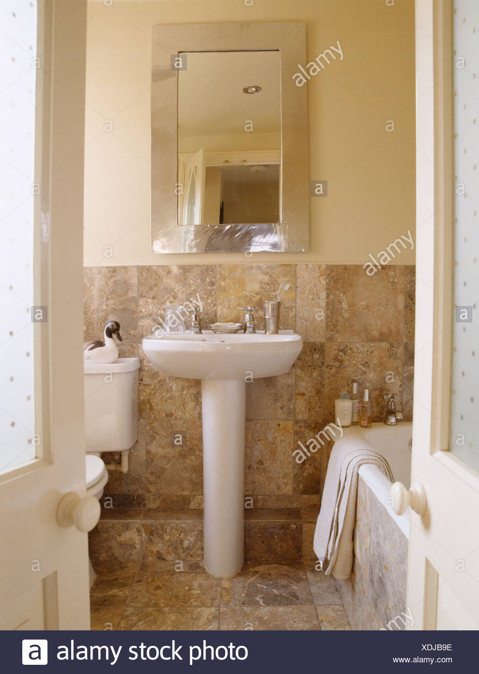 Rectangular Mirror Above Pedestal Basin In Country Bathroom With
