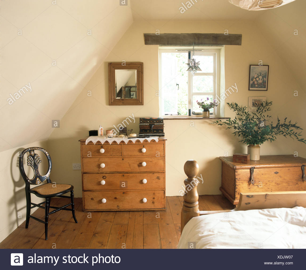 Small Antique Chair And A Pine Chest Of Drawers In A Cottage