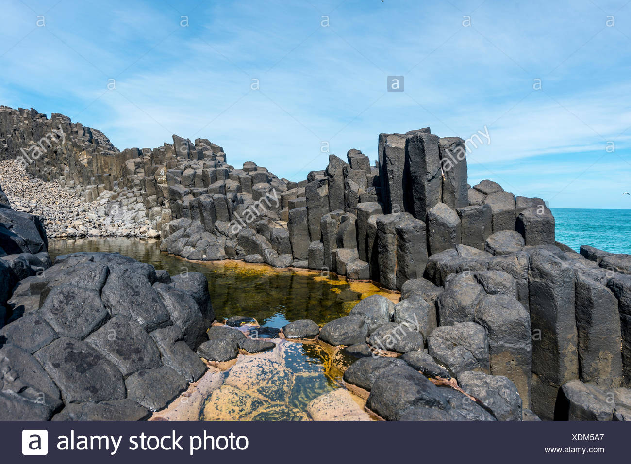 Hexagonal basalt column by the sea, Blackhead, Dunedin, Otago, South Island, New Zealand Stock Photo