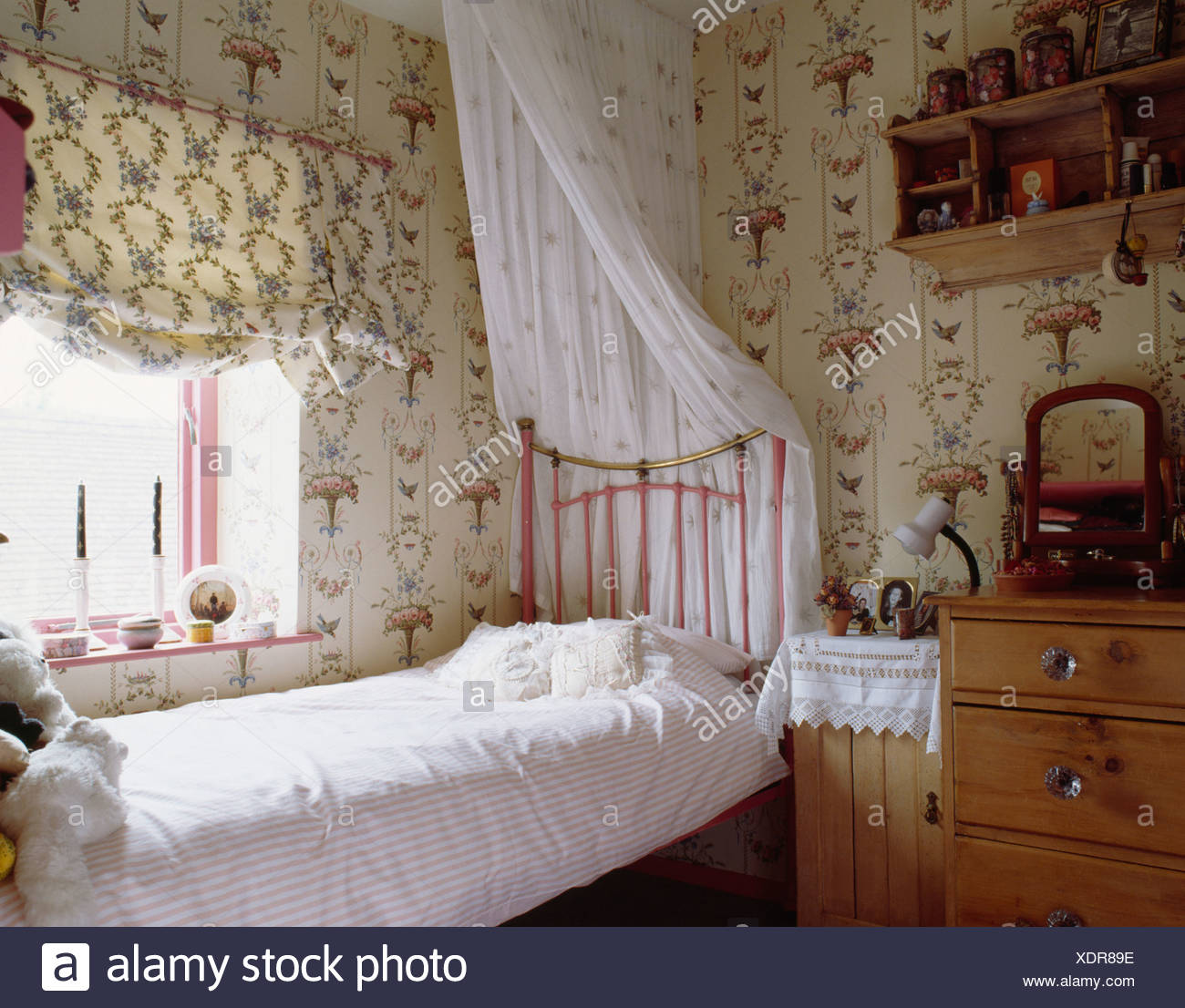 Patterned Wallpaper And Blind In Teenager Girls Bedroom With