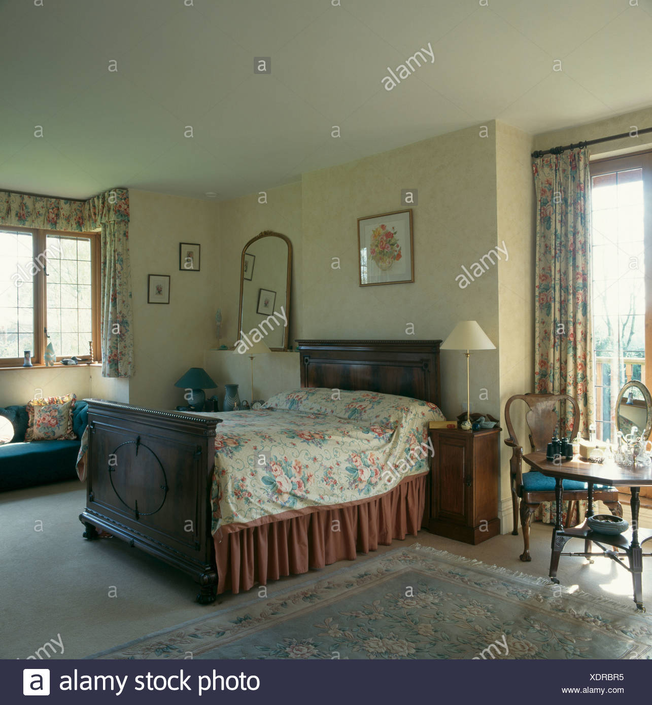 Floral Bedcover And Brown Valence On Mahogany Bed In Bedroom