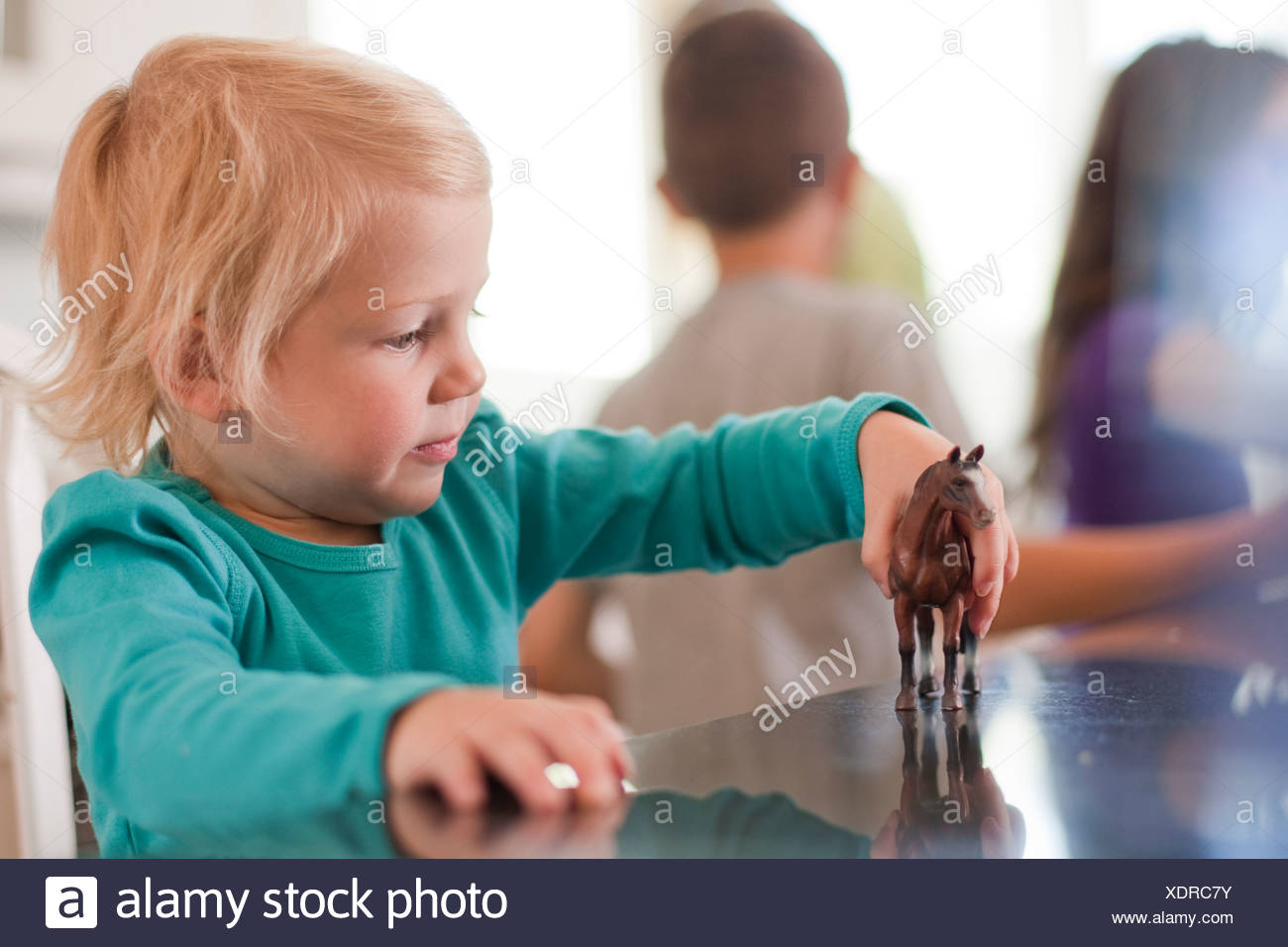 playing with toy horses