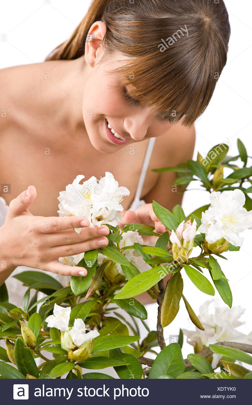 Gardening - Portrait of woman with Rhododendron Stock Photo
