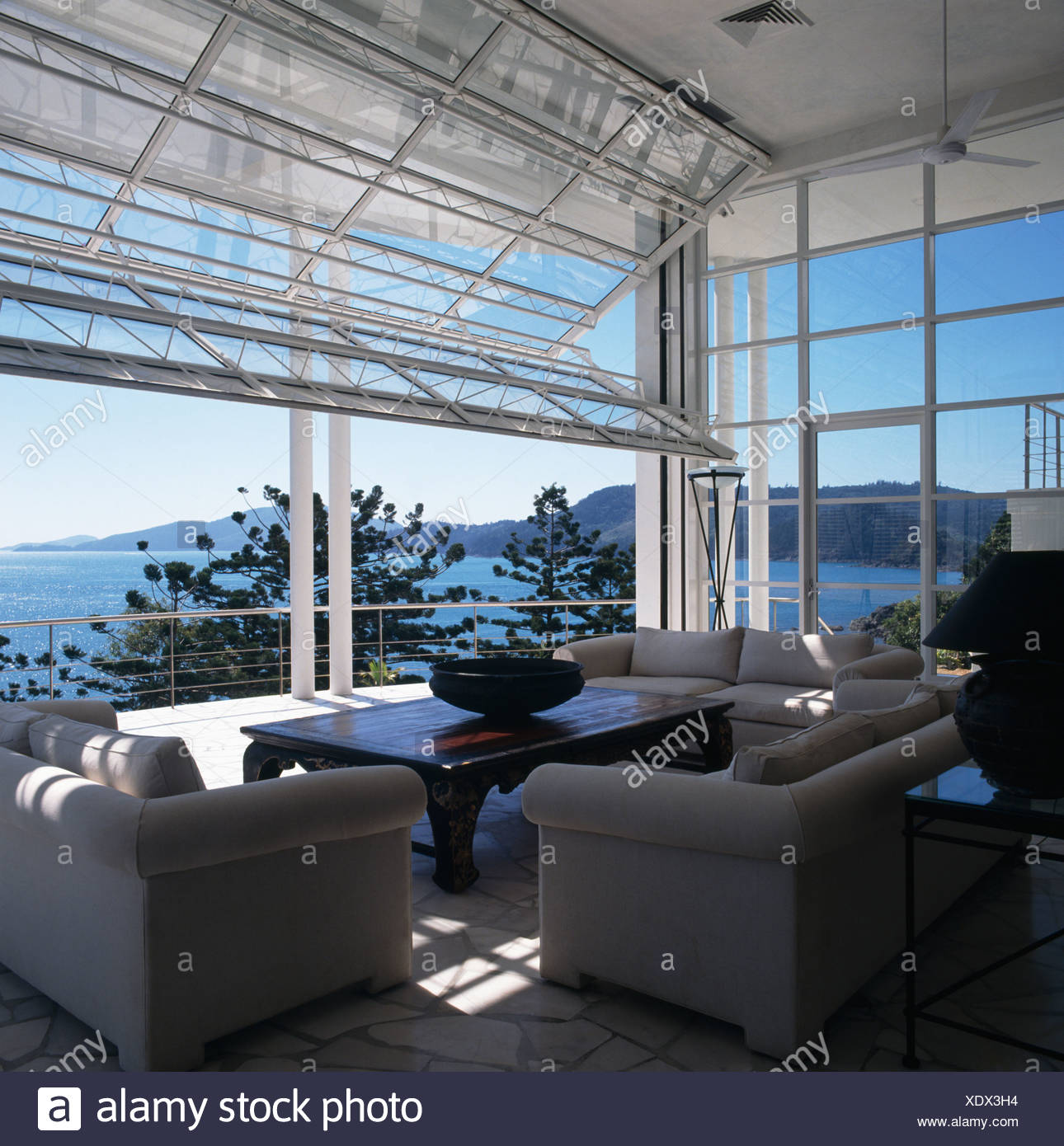 View Of The Ocean From Modern Coastal Living Room With Gray