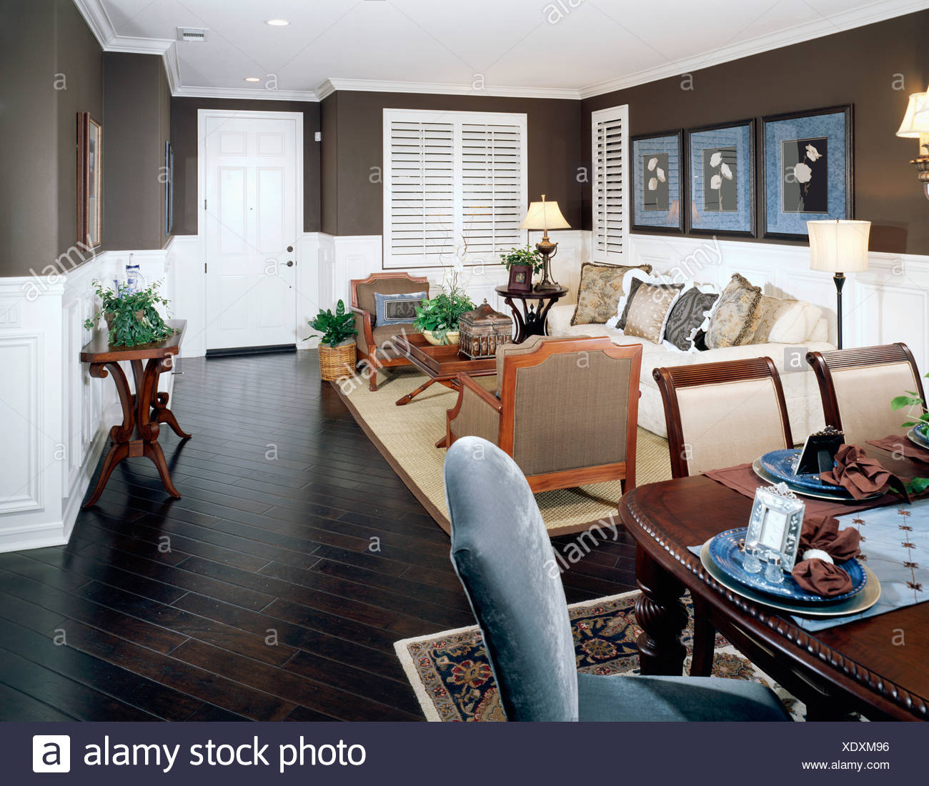 Cozy Living Room With Dark Brown Walls And Floor Stock Photo
