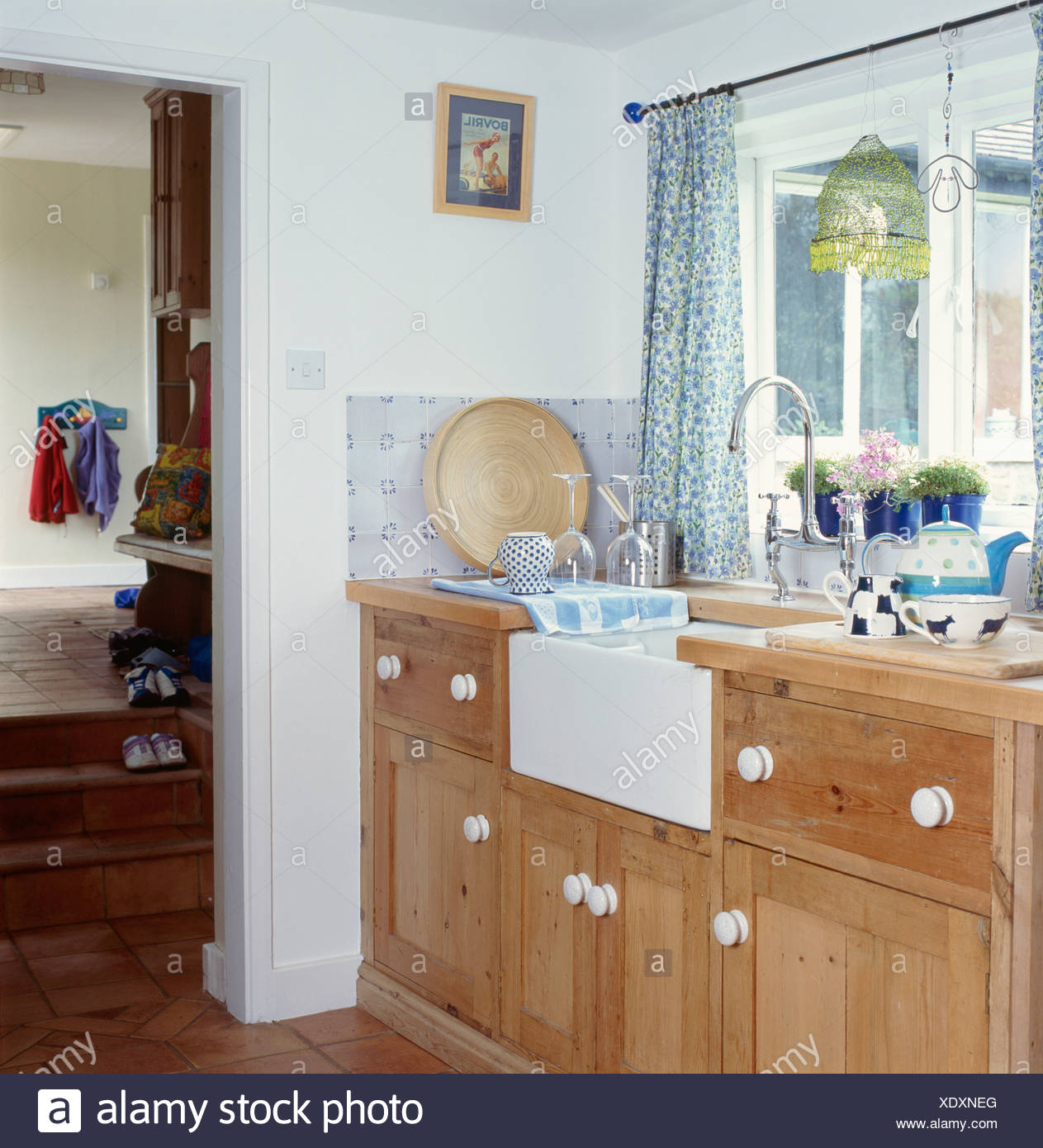 Belfast Sink In Fitted Wood Unit Below Window With Blue Floral