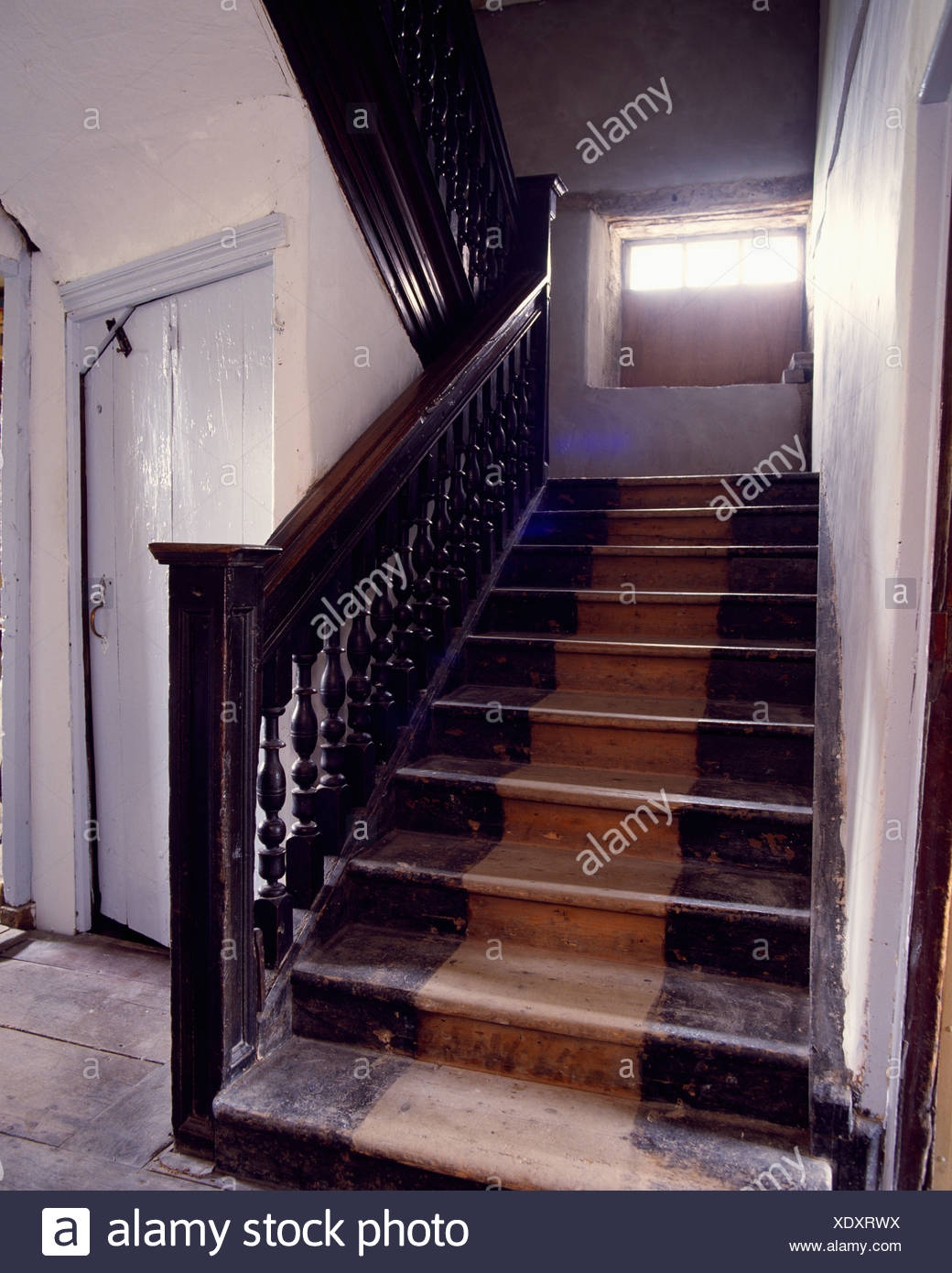 Old Wooden Staircase With Wooden Treads And Dark Wood Banisters