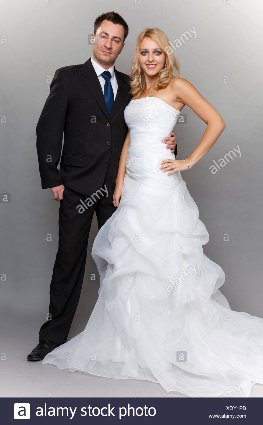 Wedding Day Portrait Of Happy Married Couple Blonde Bride And