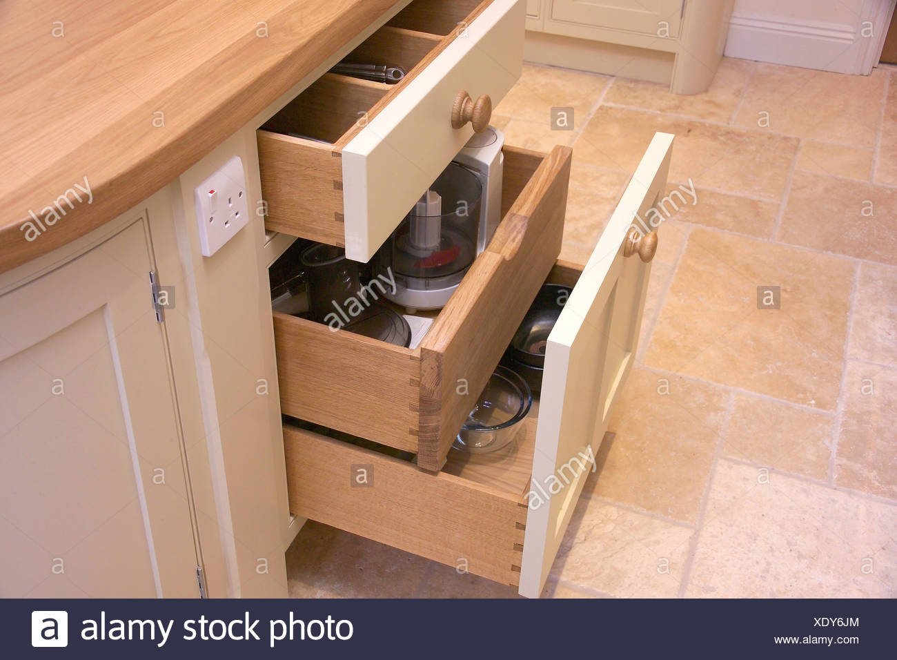Close Up Of Kitchen Cupboards With Pull Out Drawers Stock Photo
