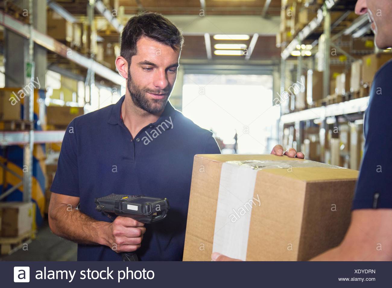 Male Warehouse Using Barcode Scanner High Resolution Stock Photography