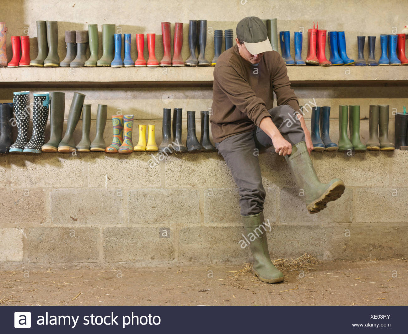 Pulling On Boot High Resolution Stock Photography and Images Alamy