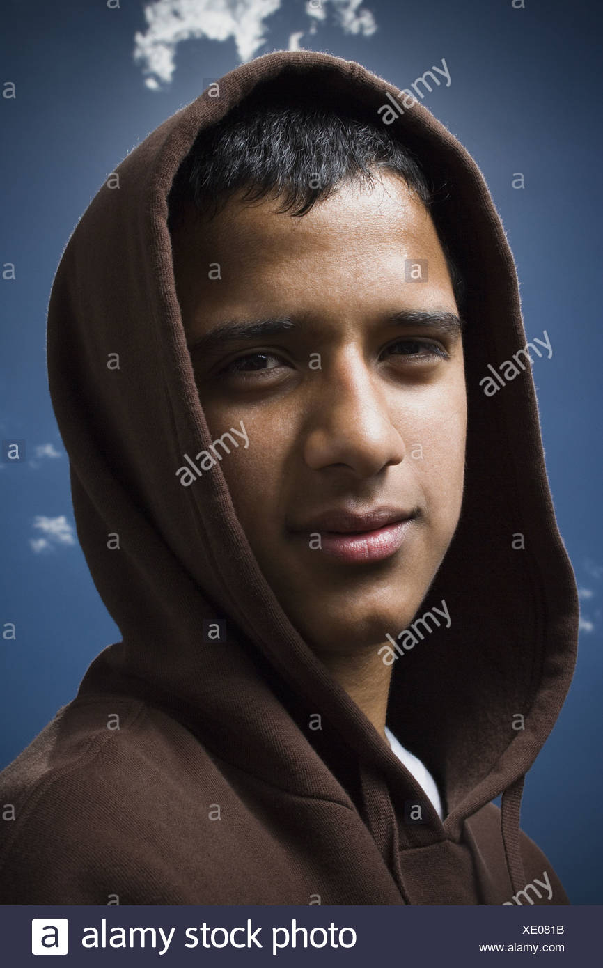 Download Portrait of a teenage boy wearing a hoodie Stock Photo ...