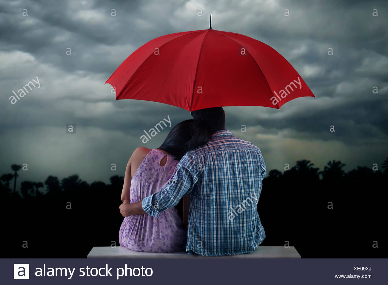 Couple With Umbrella Sitting Stock Photo Alamy Couple With Umbrella Sitting Stock Photo Alamy