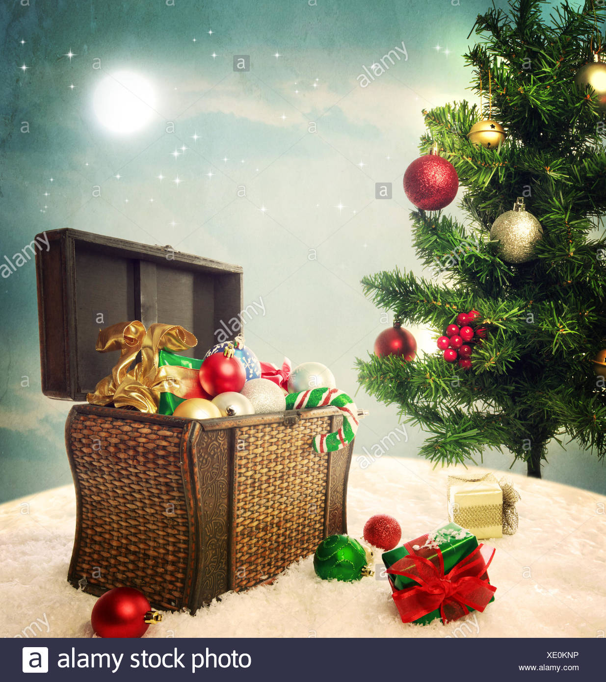Treasure Box Filled With Christmas Ornaments And Presents On Snow With Christmas Tree Stock Photo Alamy