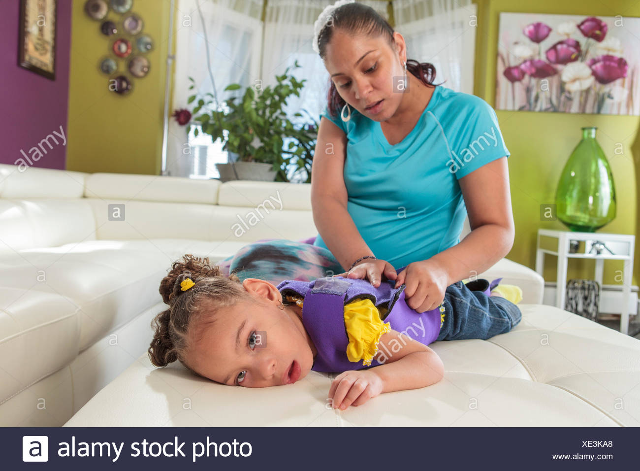 Mother Caring For Daughter With Cerebral Palsy Stock Photo Alamy