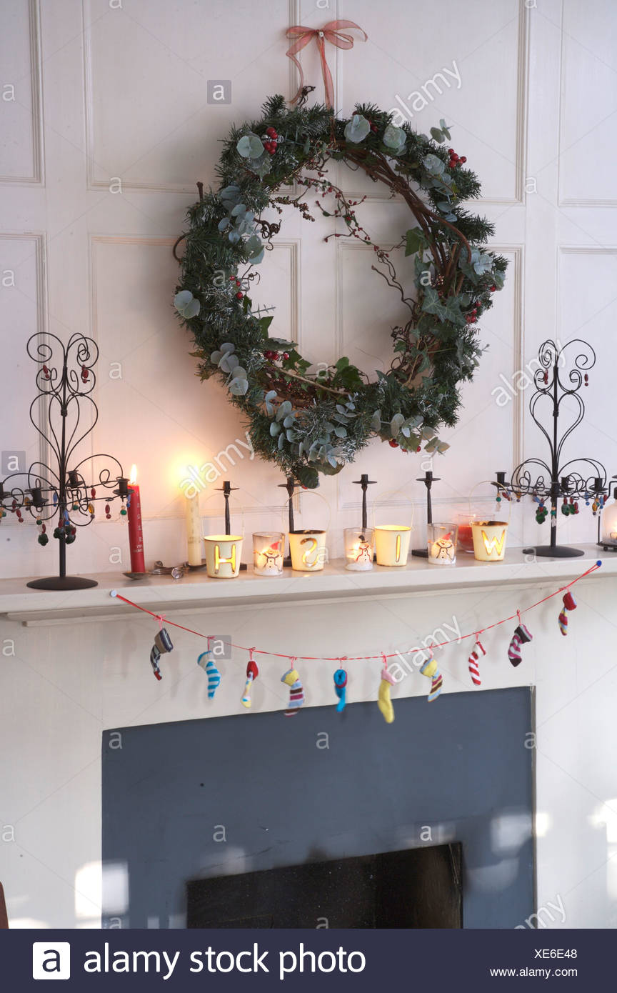 Ivy And Conifer Wreath Above Fireplace Decorated For Christmas